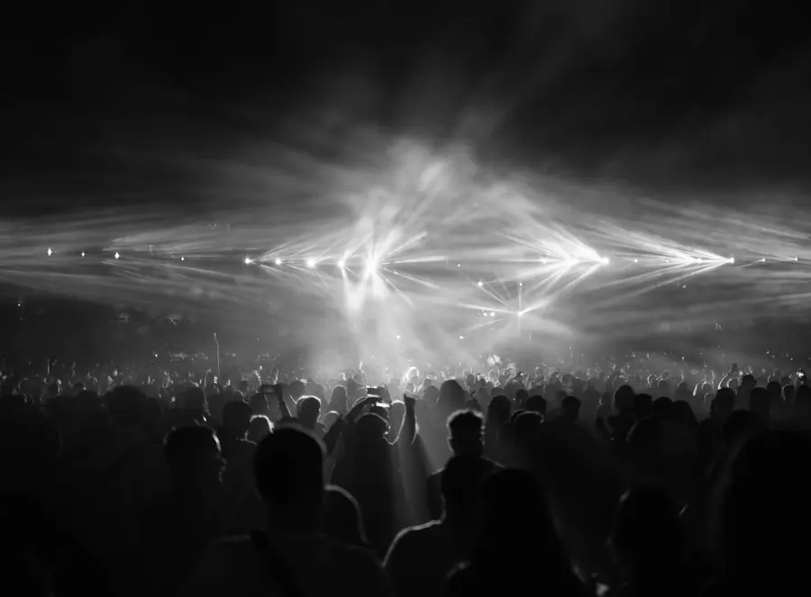 A concert crowd under stage lights