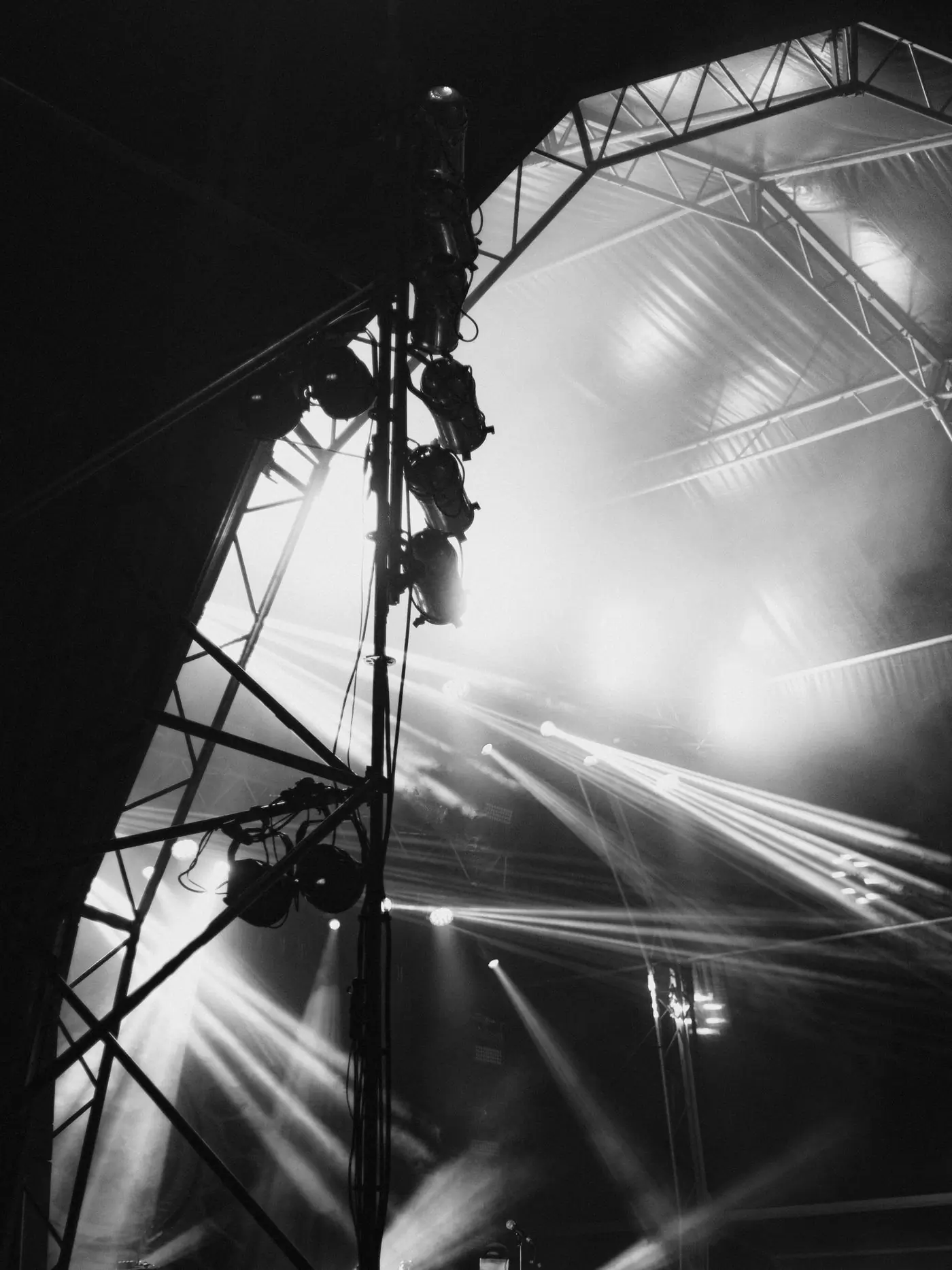 Stage lighting rigged on a truss above a venue