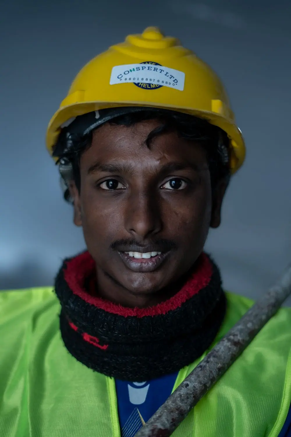 A site operative in a hard hat and hi-vis