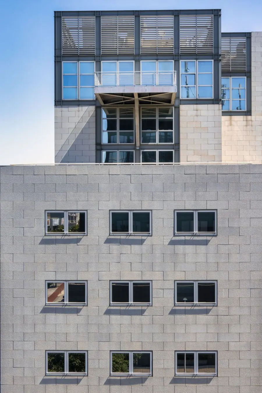A concrete teaching block with deep window reveals