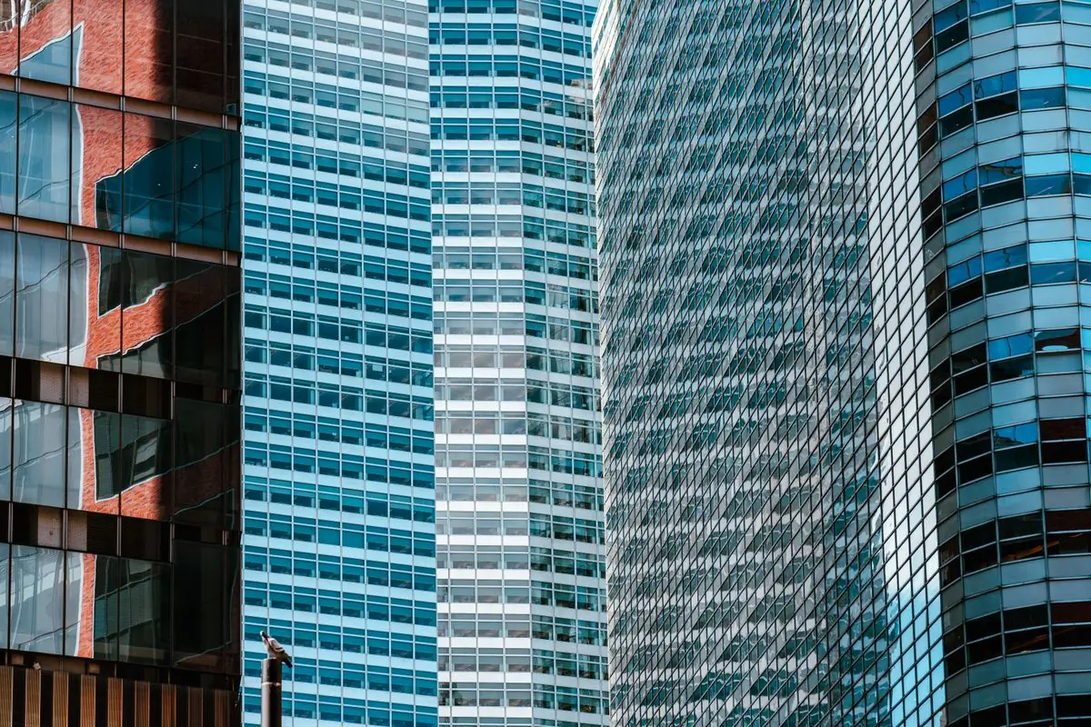The glass facade of a completed commercial tower