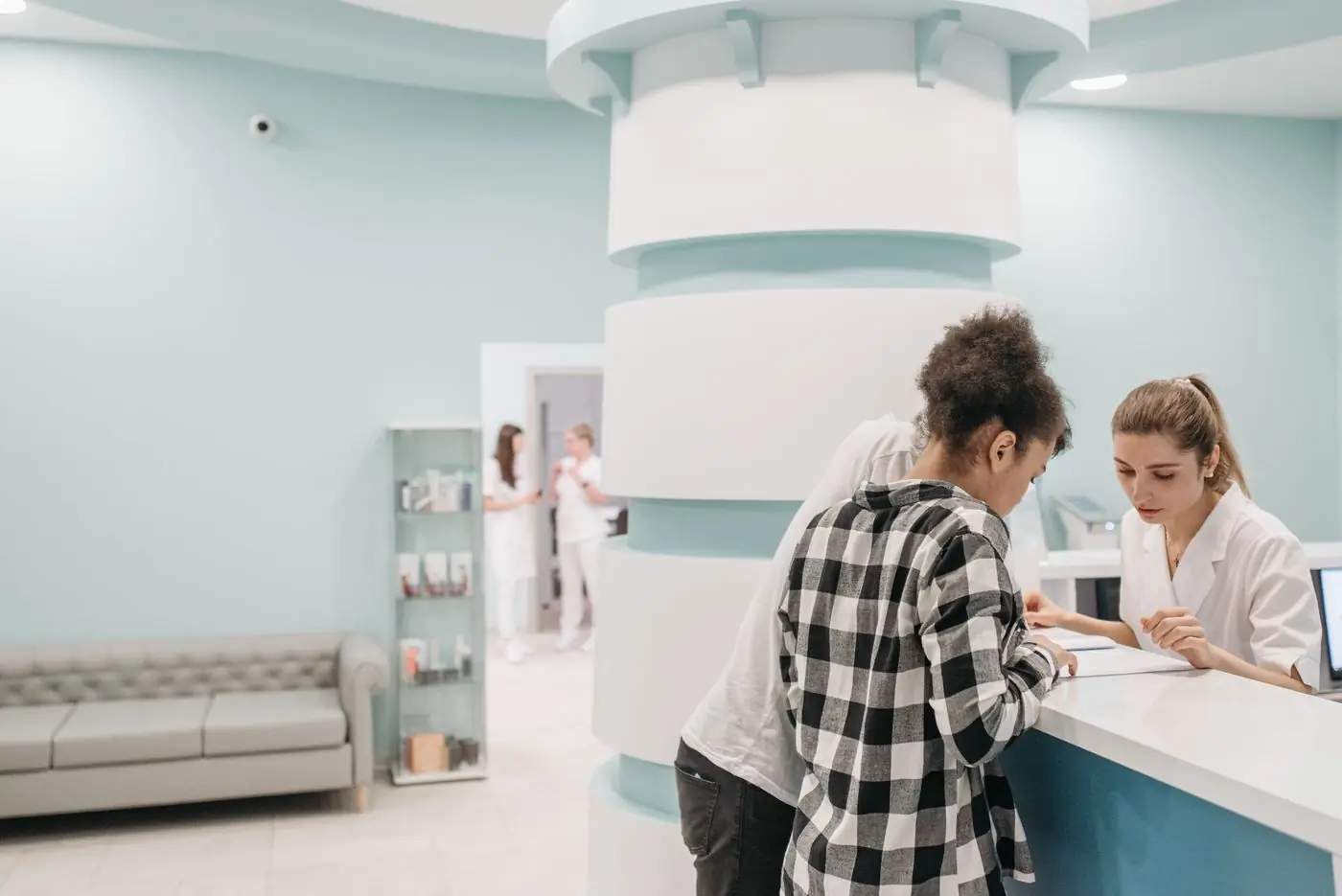 The centre's reception, with patients being checked in at the desk