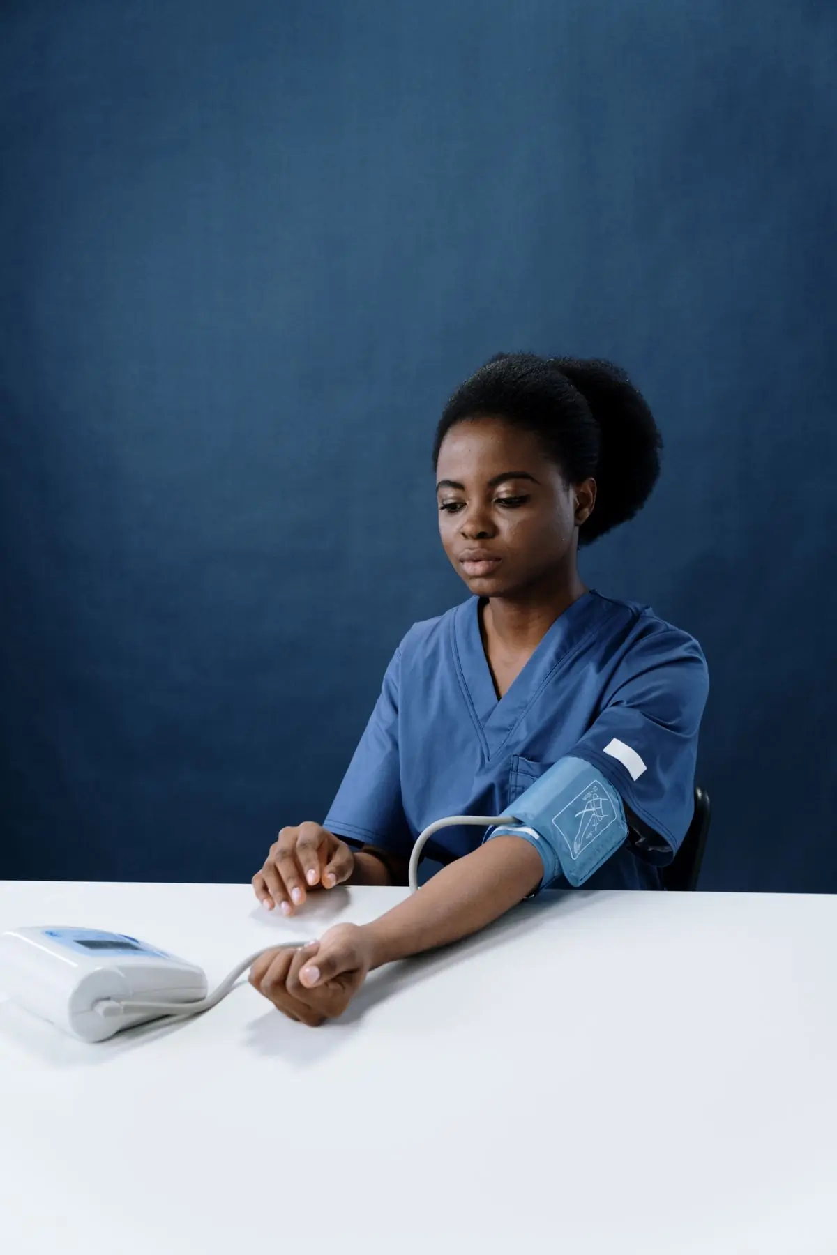 A nurse taking a blood pressure reading