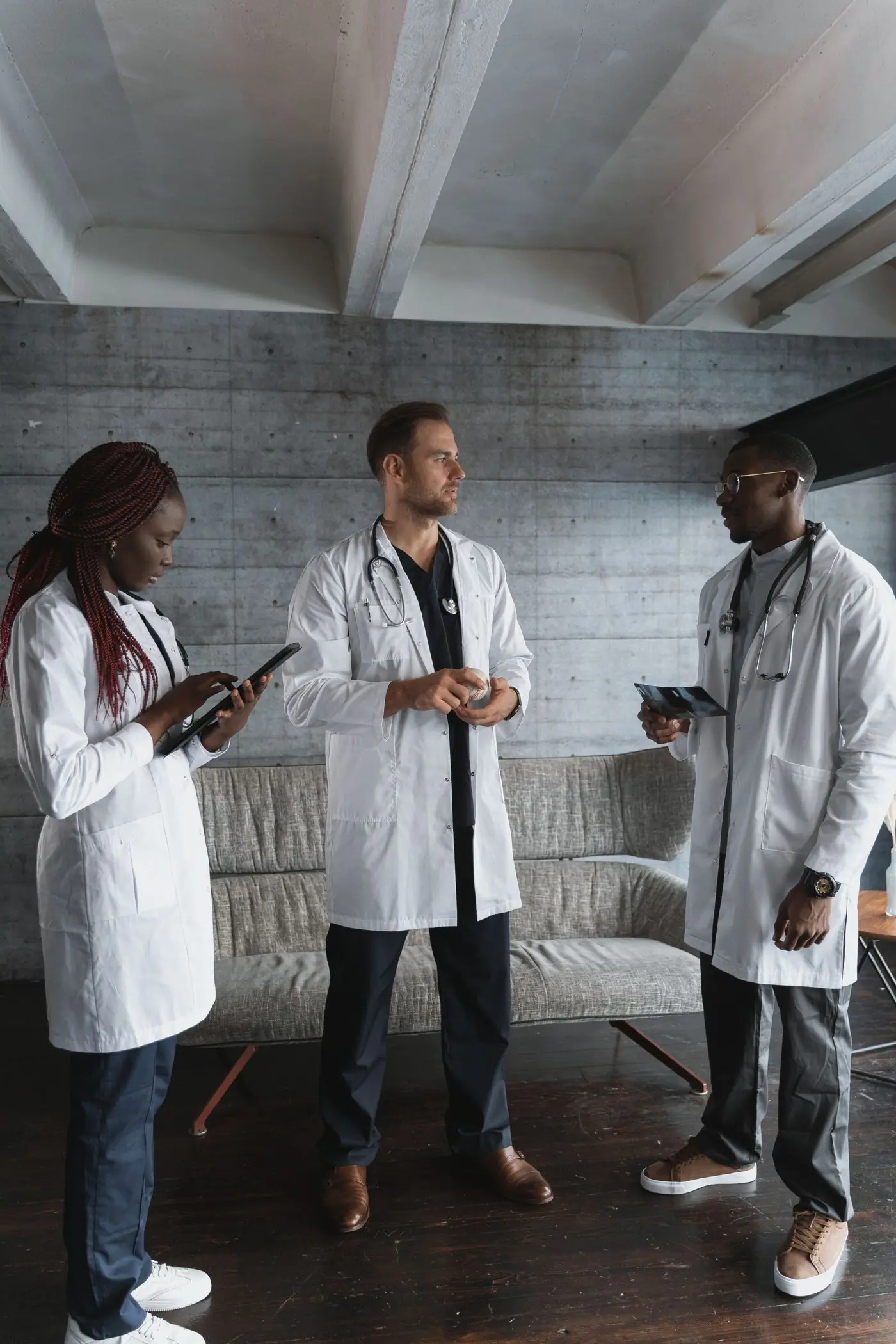 Three of the centre's clinicians talking through a case together