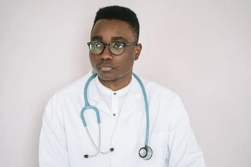 A paediatrician at the centre photographed in his white coat