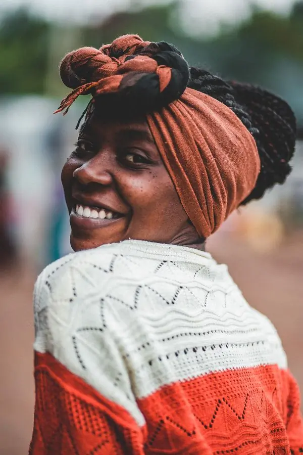 A patient of the centre smiling outdoors