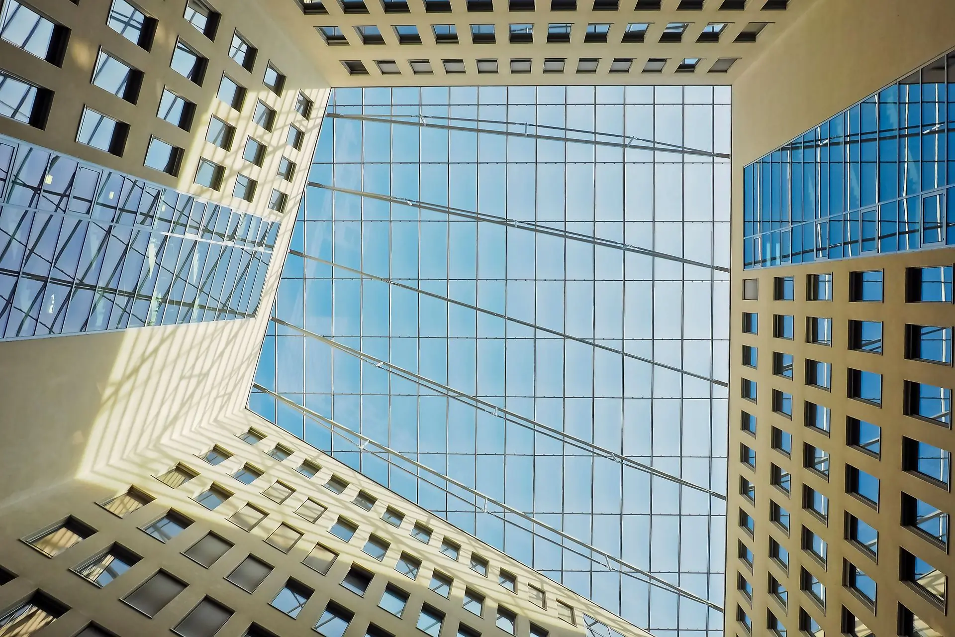 Glass and brass towers seen from the street below