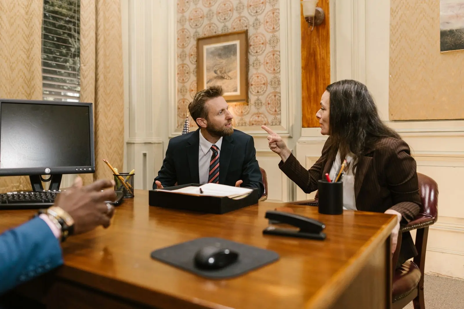 A meeting around the table in the firm's boardroom