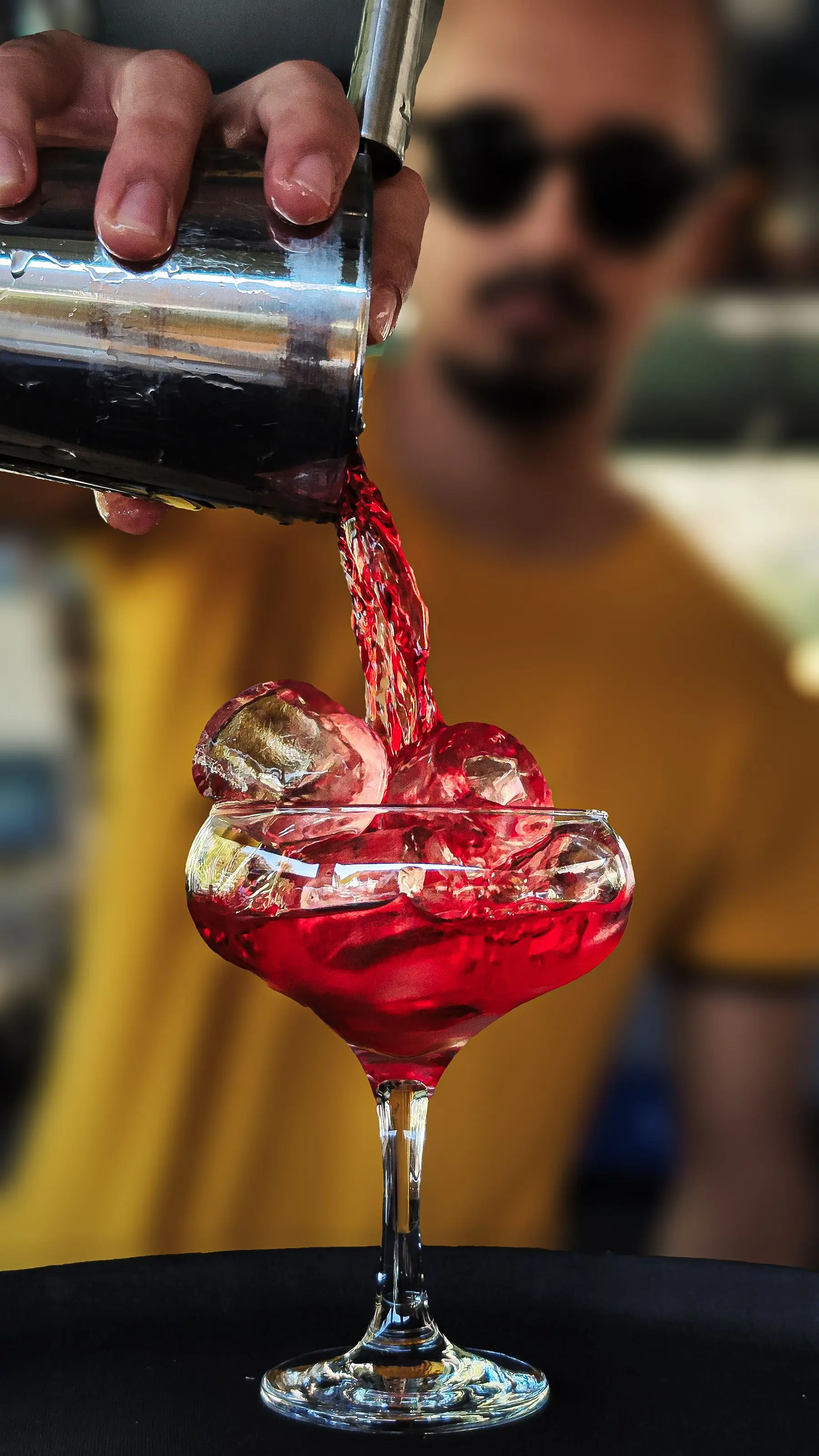 A drink being finished at the bar