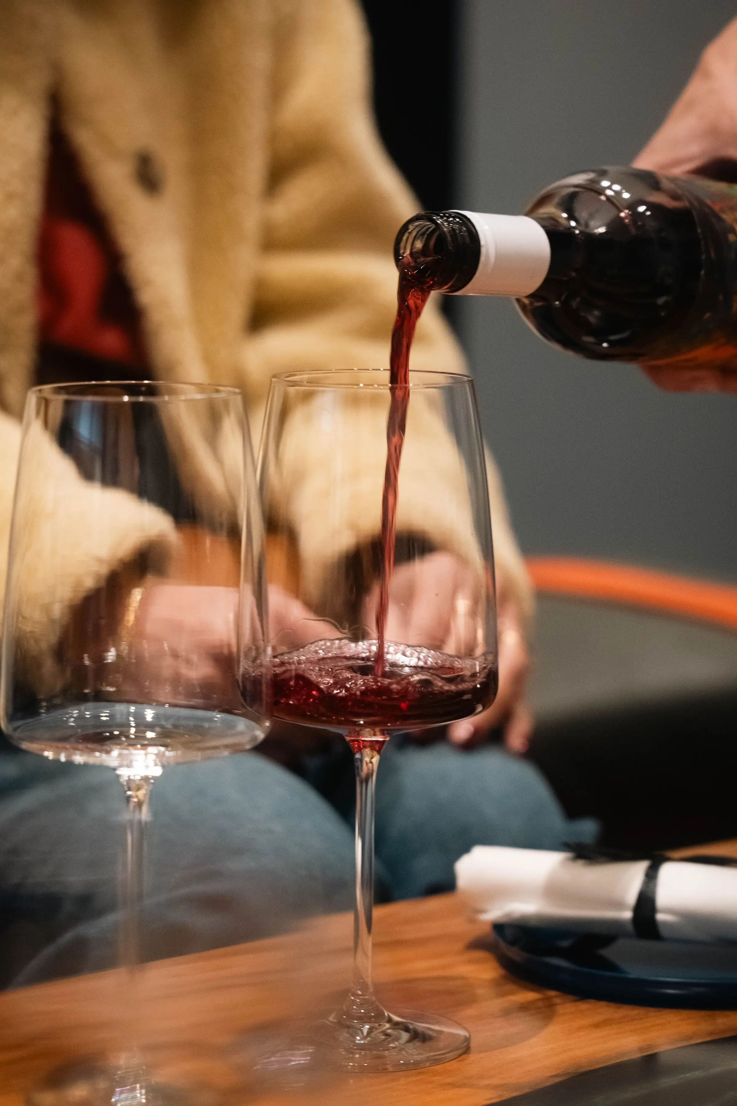 A glass being poured at a private dinner