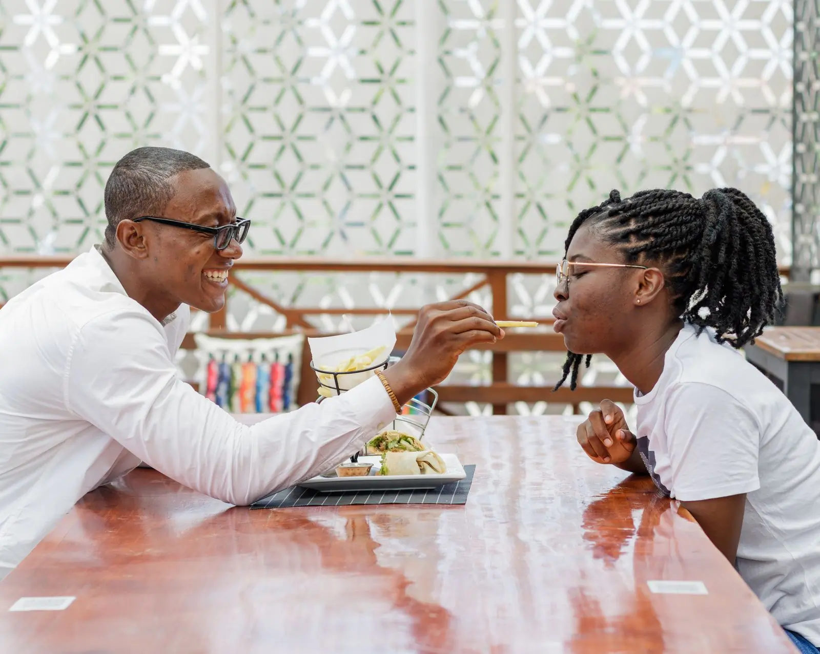 Two guests eating at a table in the main room
