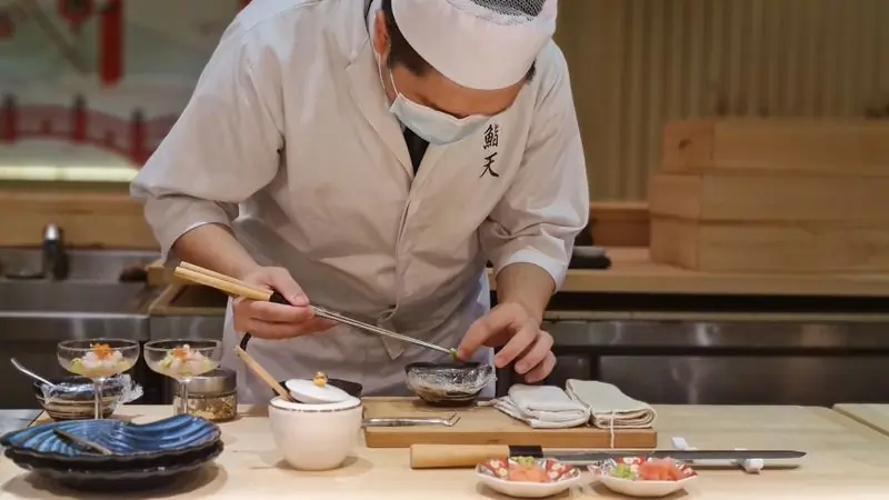 Ama Serwaa Boateng plating at the sushi counter