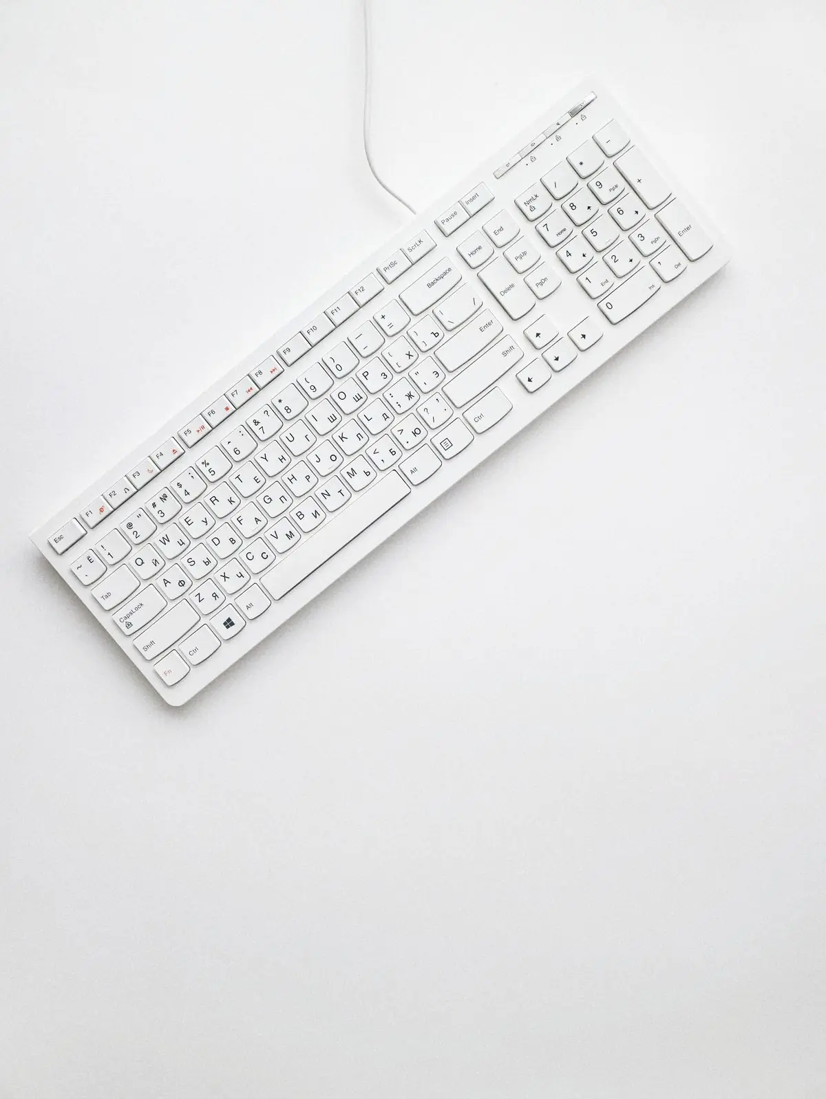 A white keyboard photographed from above on white