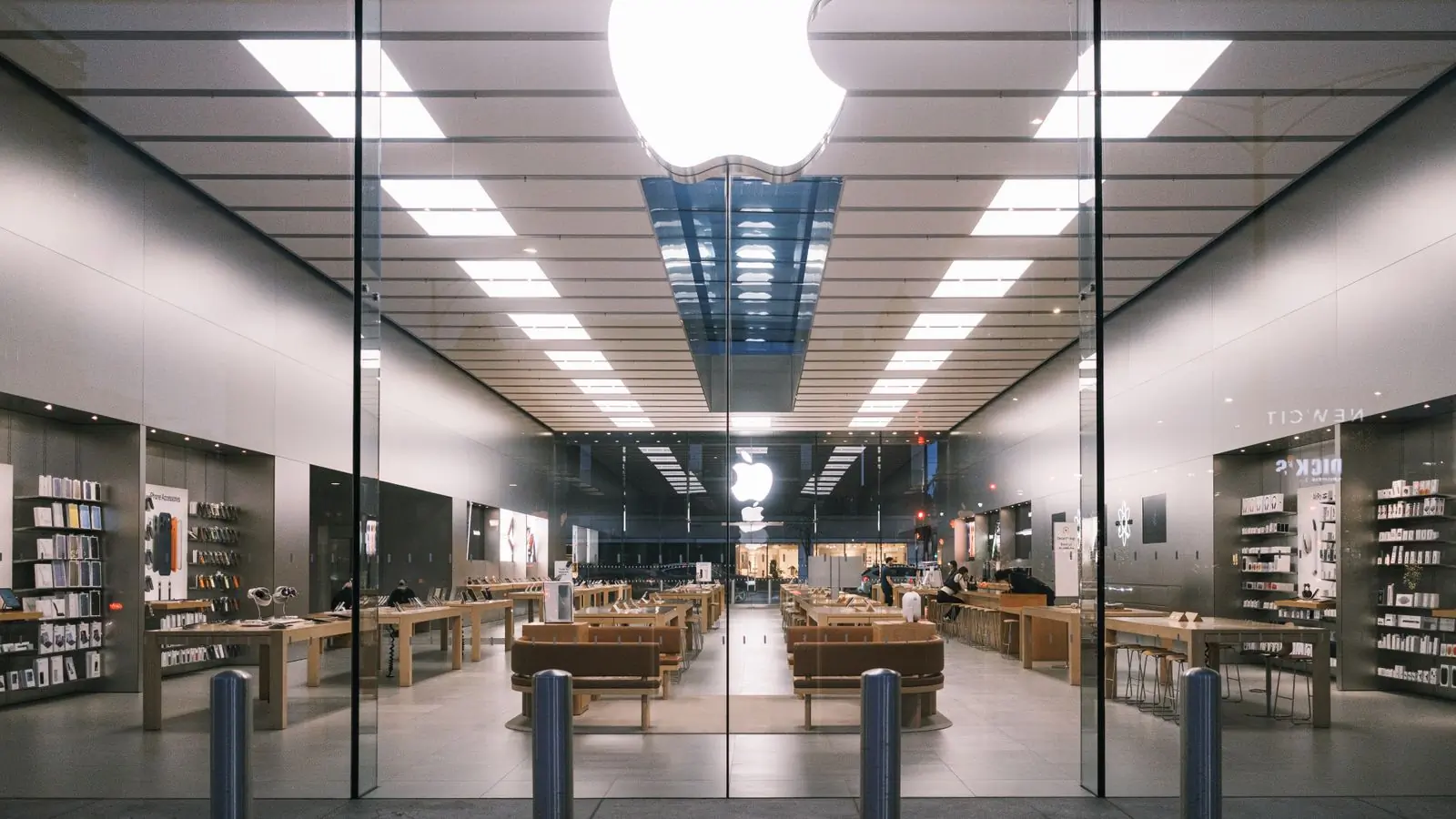 The length of a modern tech shop, brightly lit and uncluttered