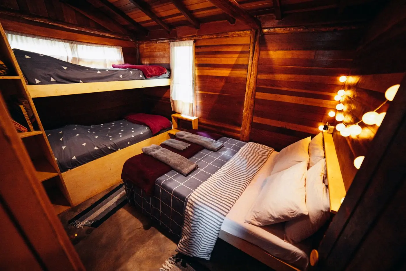 Bunk beds made up in a camp cabin