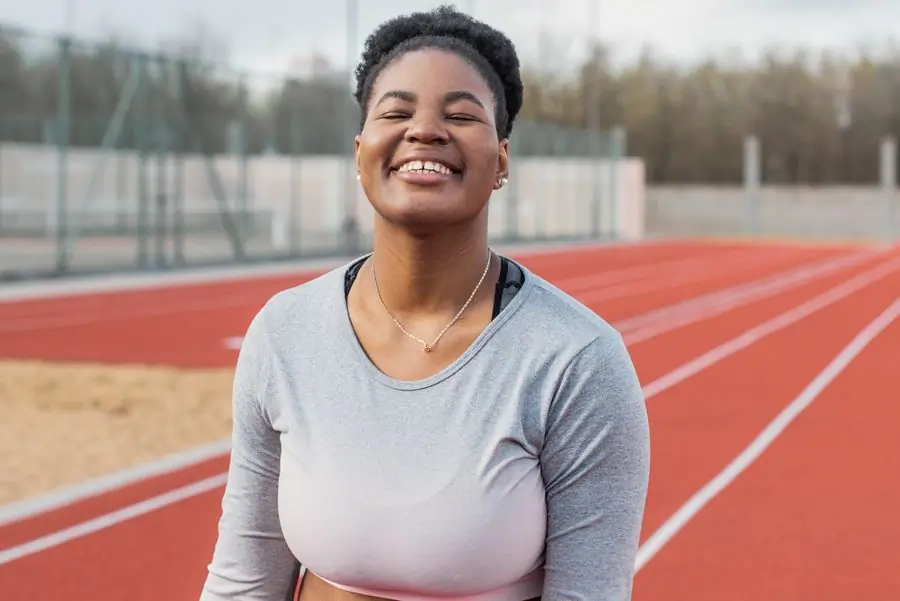 Ama Serwaa, head of athletics, laughing at the side of the track