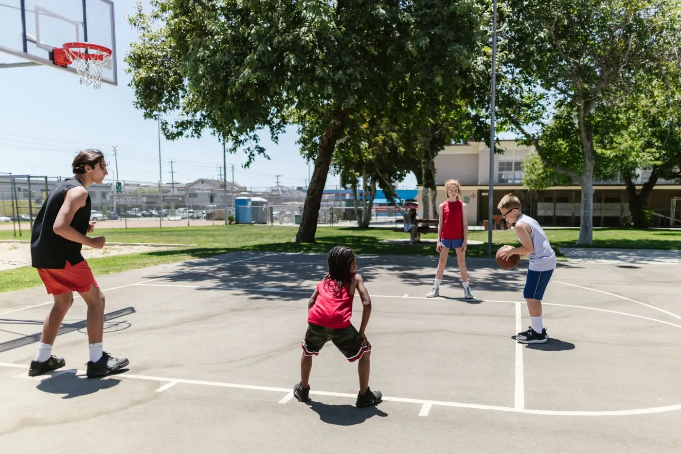 A half-court game underway on the camp basketball court
