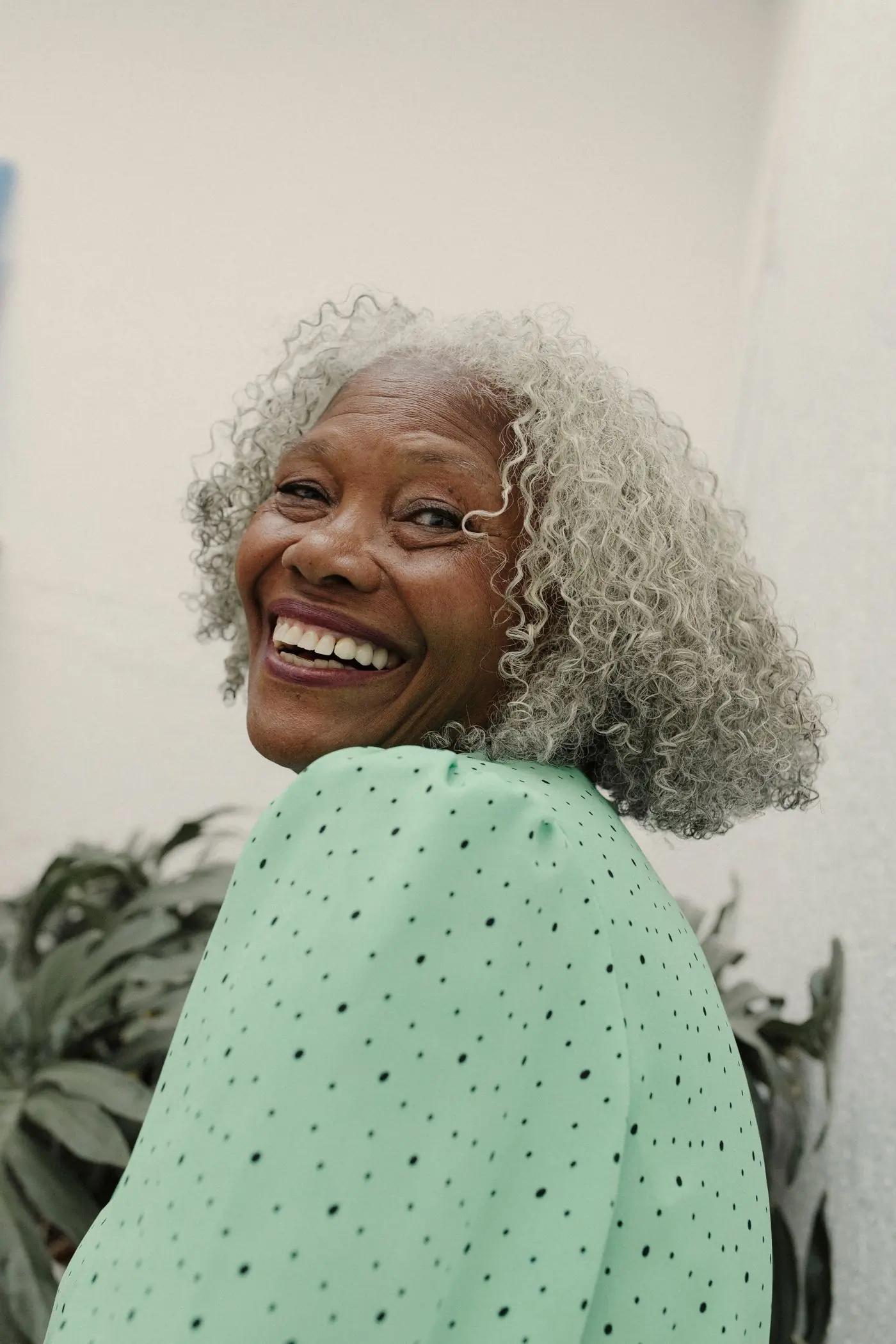 A patient of the centre laughing outdoors