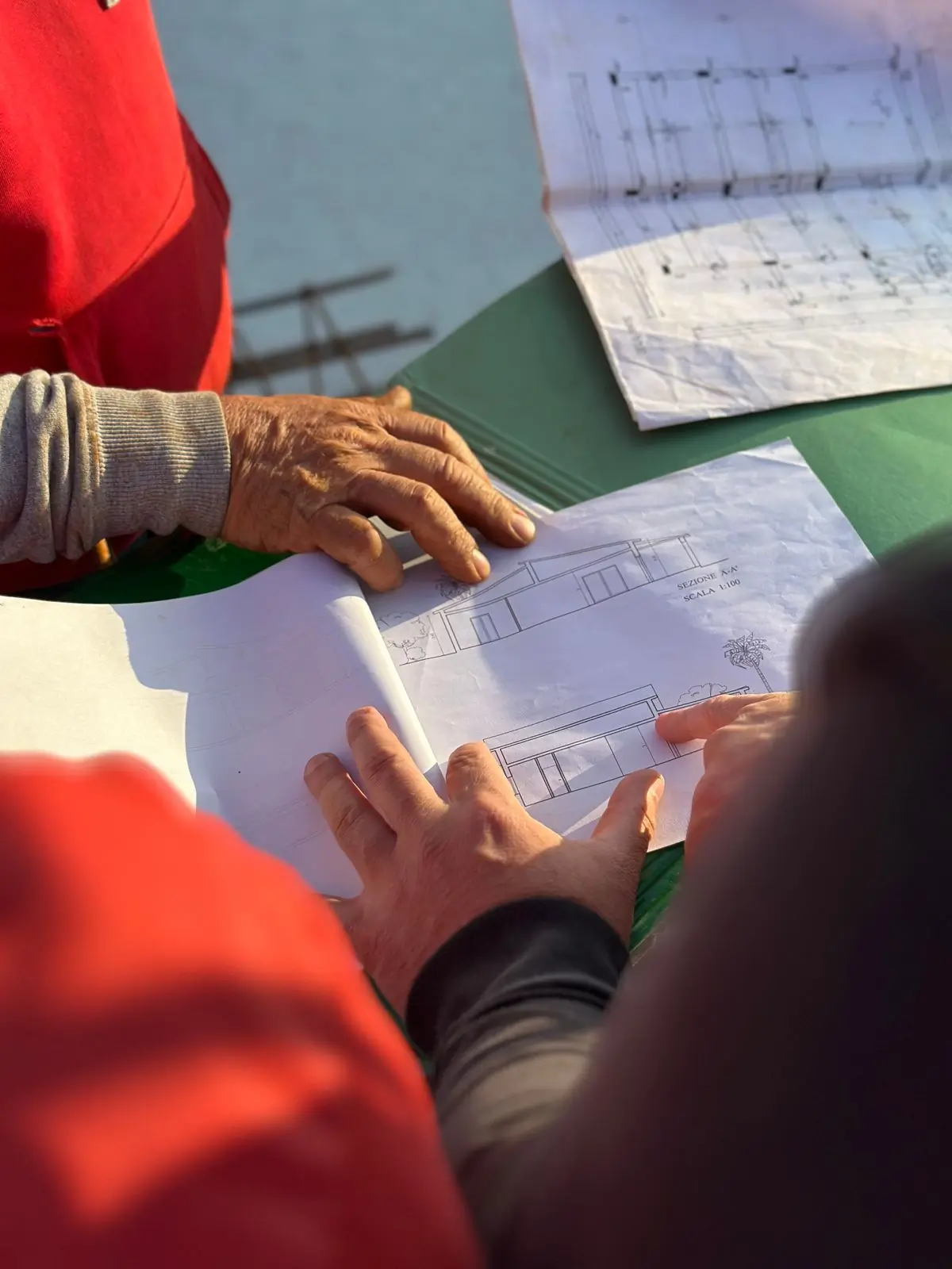 Two engineers going through drawings on site