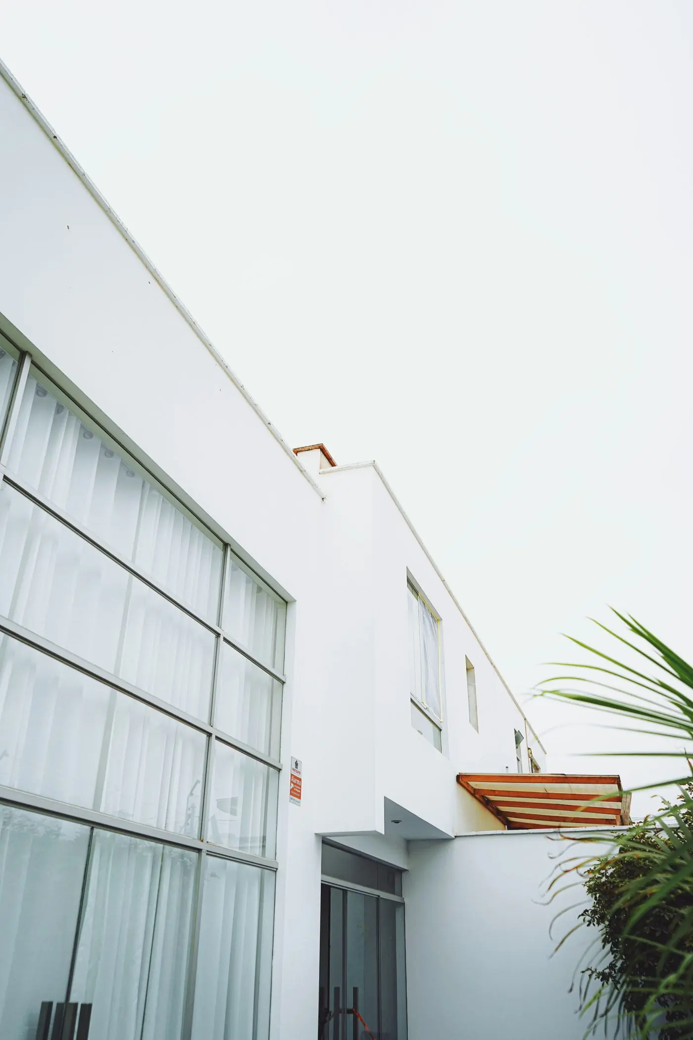 The white Cantonments Office Pavilion with its deep window reveals