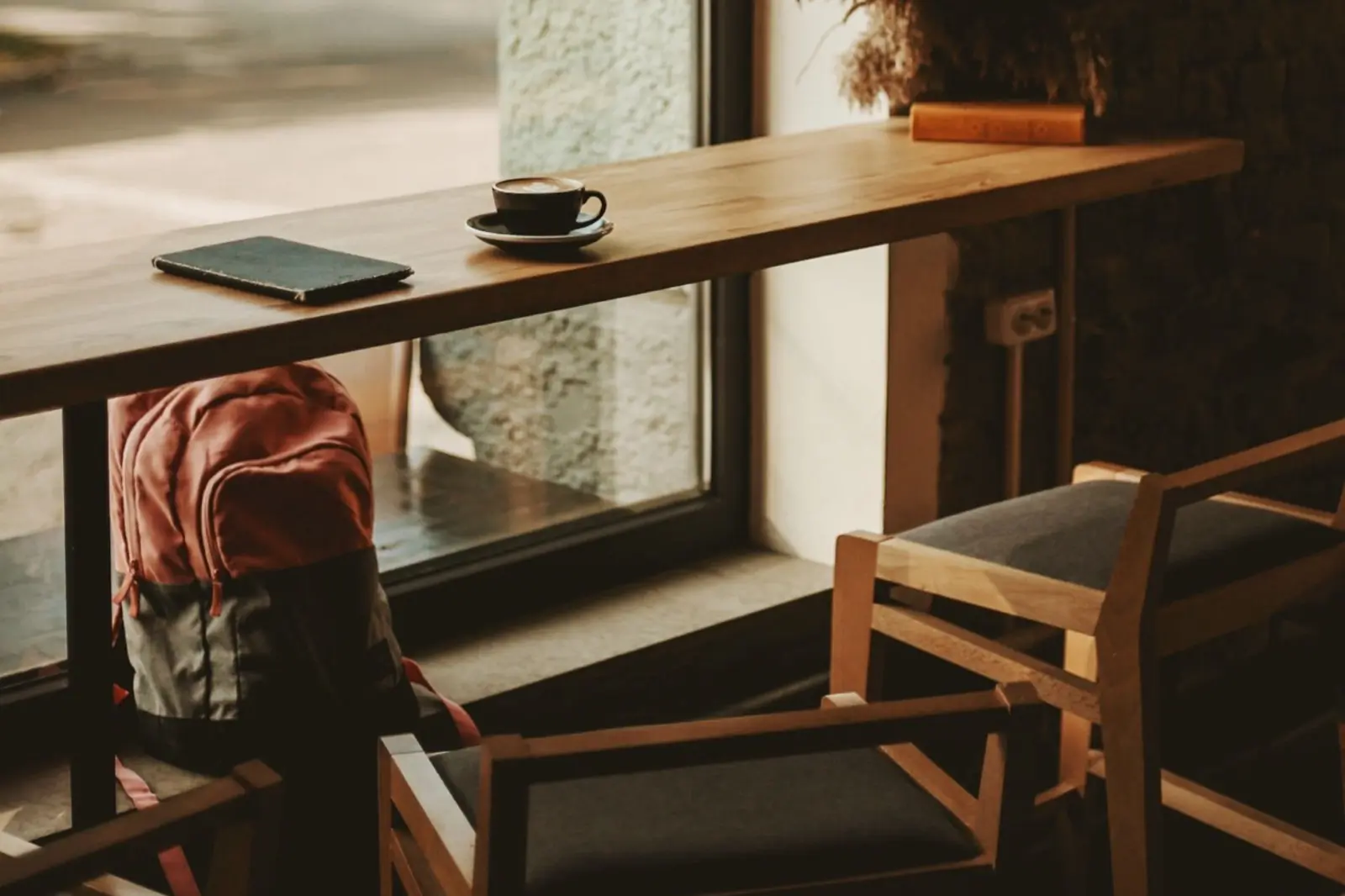 The window bar at Labone, with armchairs pulled up in the afternoon light