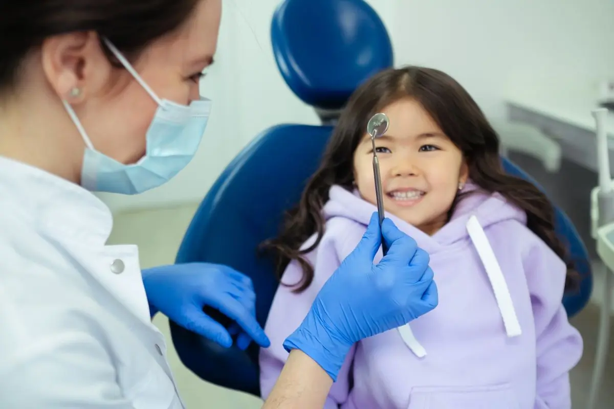 A child during a check-up with one of the clinic's dentists