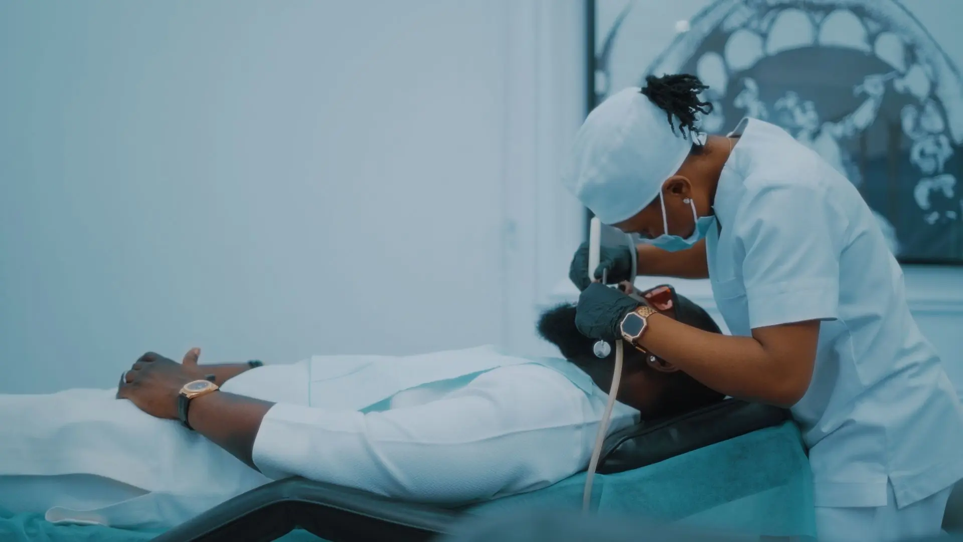 A dentist treating a patient in one of the clinic's surgeries