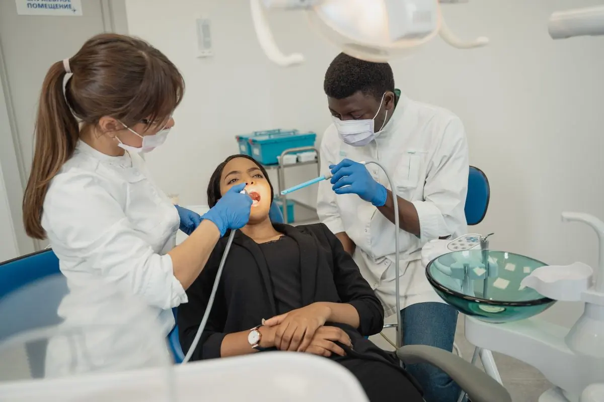 Two of the clinic's clinicians working together on a treatment
