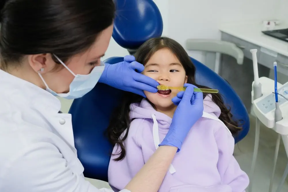 A young girl having her teeth checked at the practice