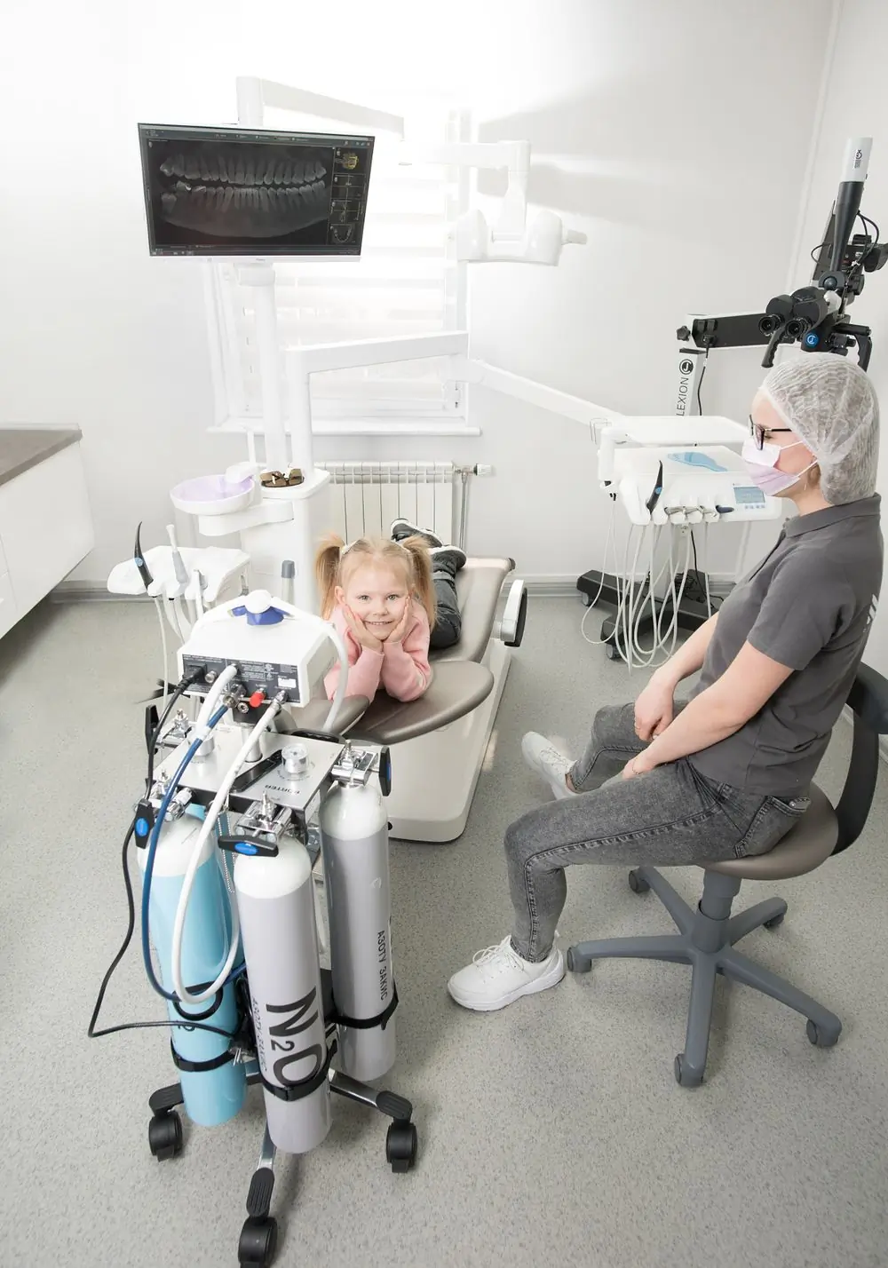 A child at ease in the chair during a check-up