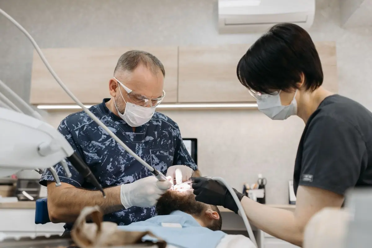 Two clinicians working together during a surgical procedure