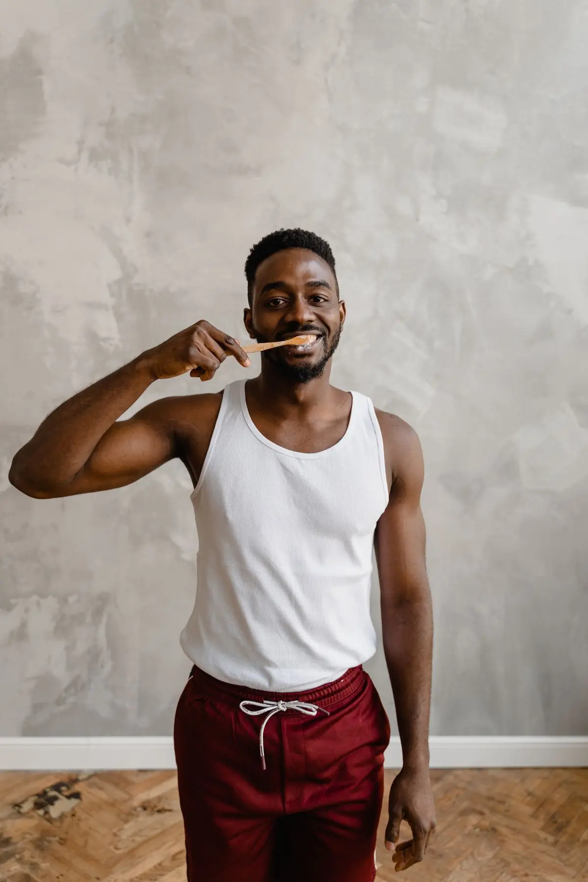 A man brushing his teeth at home