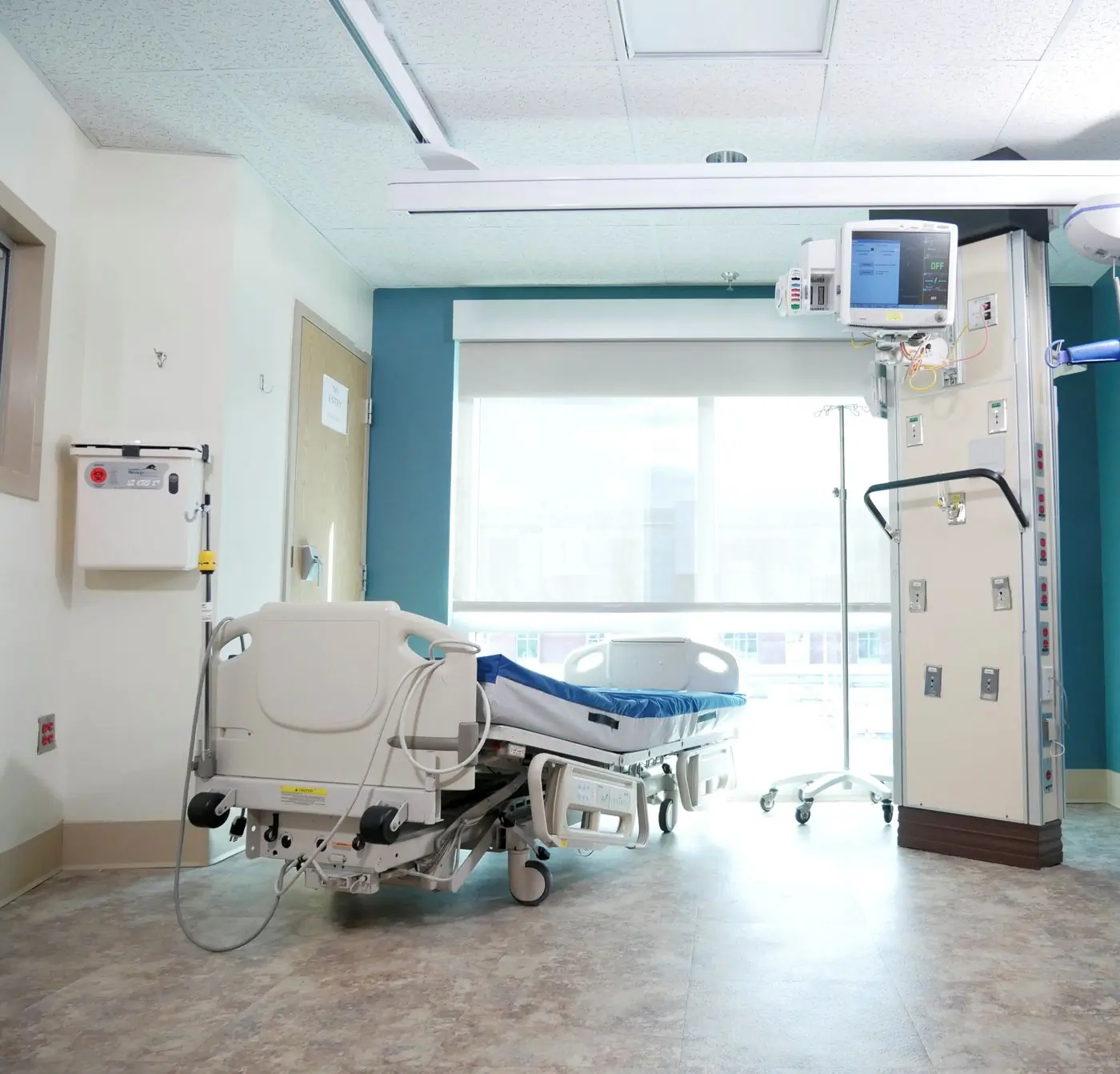 A single-occupancy room on the children's ward, with a parent bed beside the cot