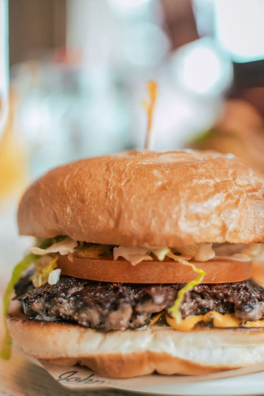 A juicy cheeseburger with layered toppings