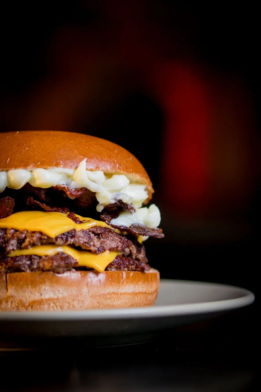A juicy cheeseburger with melted cheese in a brioche bun