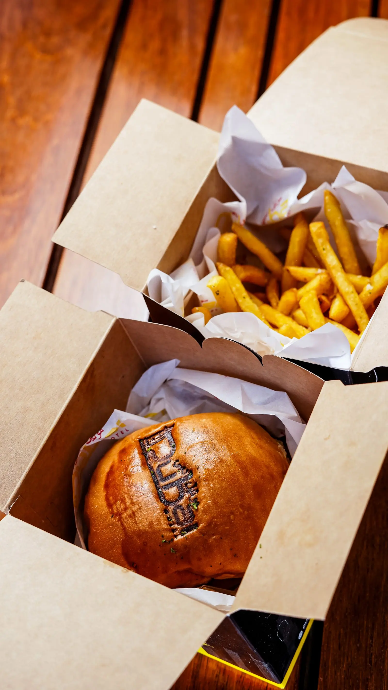 Burgers and hand-cut fries packed into a takeaway box