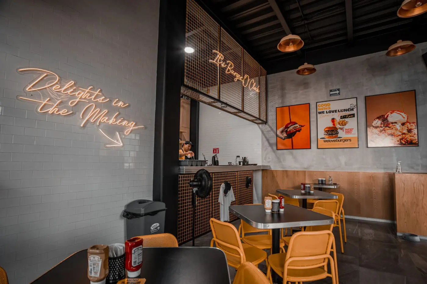 The dining room lit by neon in the evening
