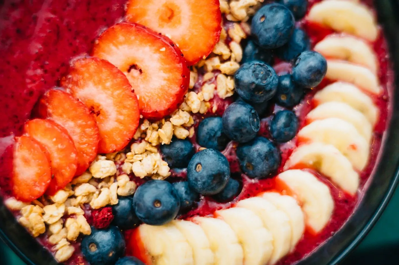 Milk, cocoa and fresh fruit laid out on a steel bench before a batch