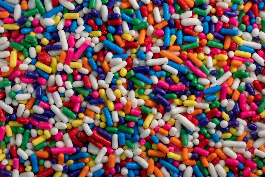 A close crop of coloured sprinkles filling the whole frame