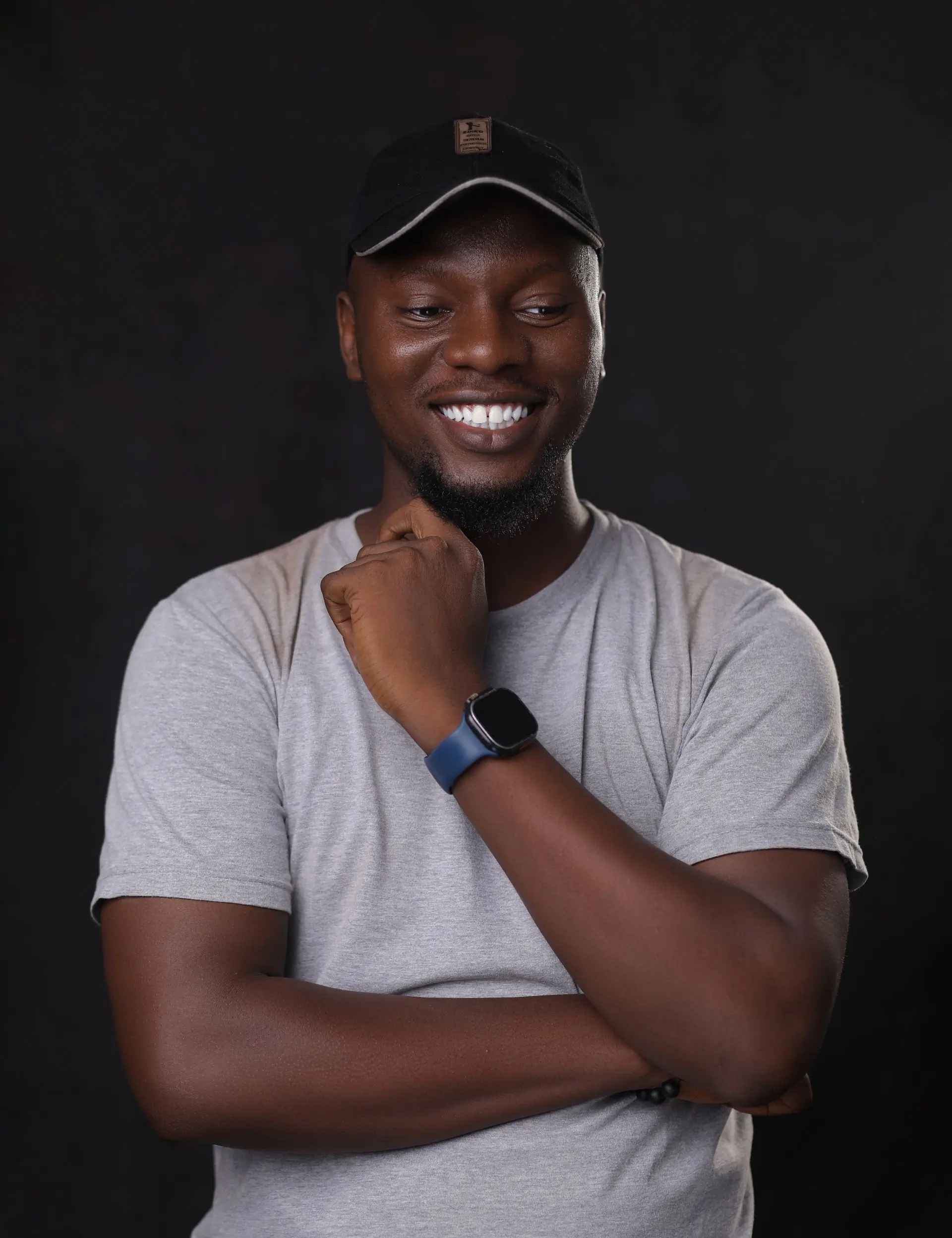 A man in a bright shirt smiling at the camera