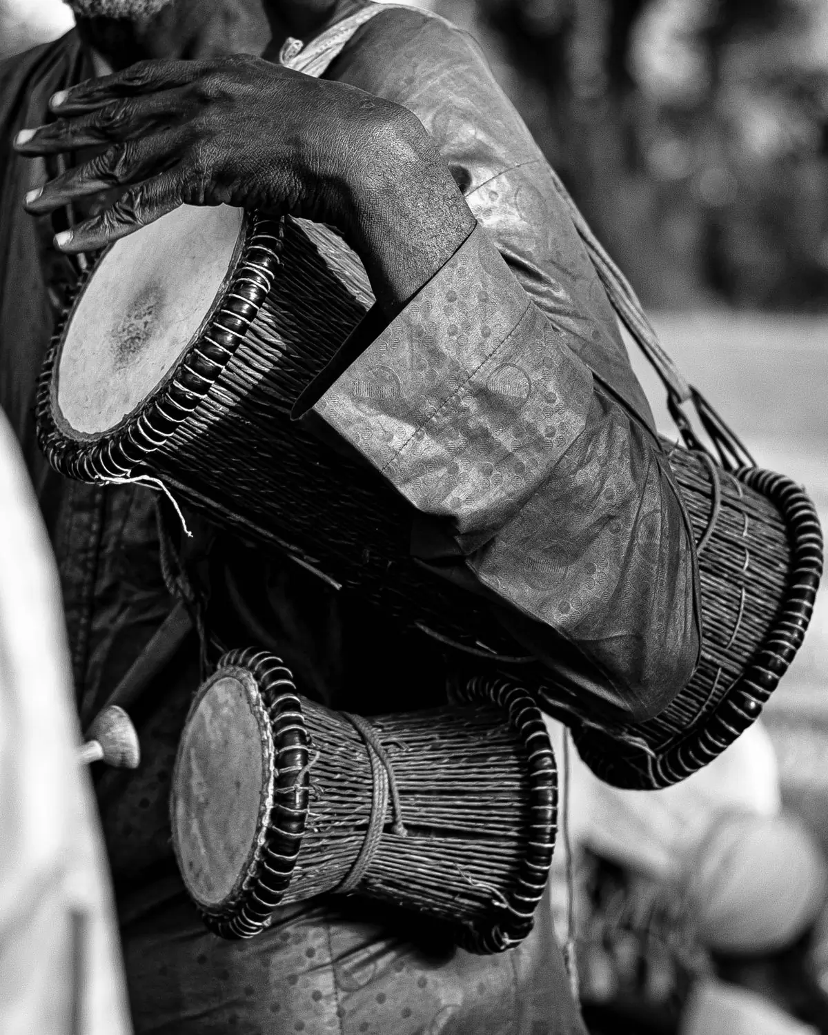 A close view of traditional African talking drums in black and white