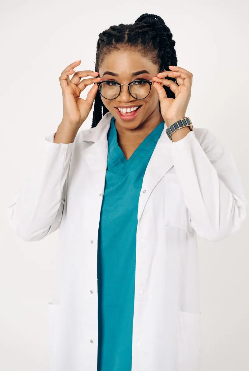 Dr. Adjoa Mensah, consultant physician, in her white coat