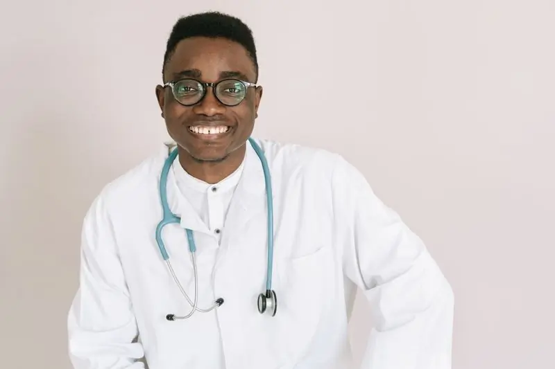 Dr. Yaw Asante, family physician, wearing a stethoscope