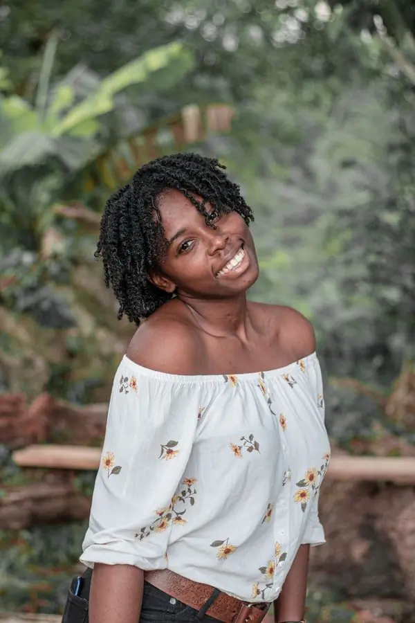 Ama Serwaa, a patient, smiling outdoors