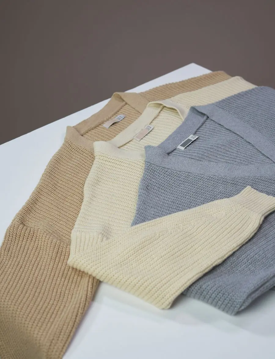 Folded knit jumpers in oatmeal and grey