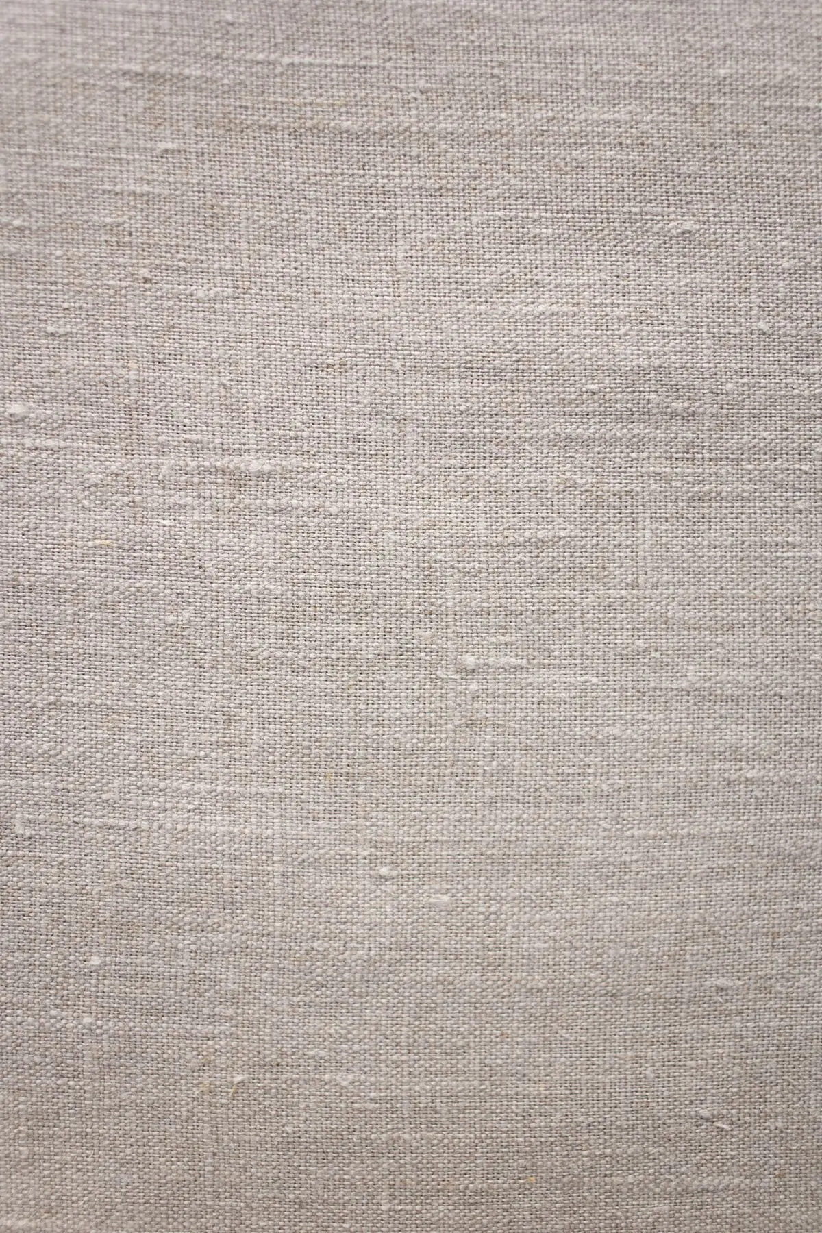 A close view of the natural linen weave the shirt is cut from