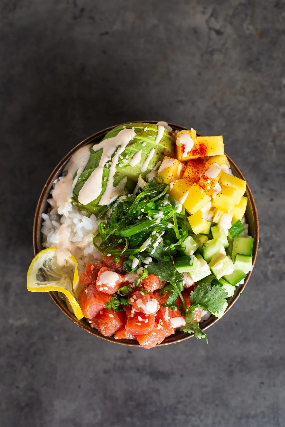 A poke bowl of rice, vegetables and sesame