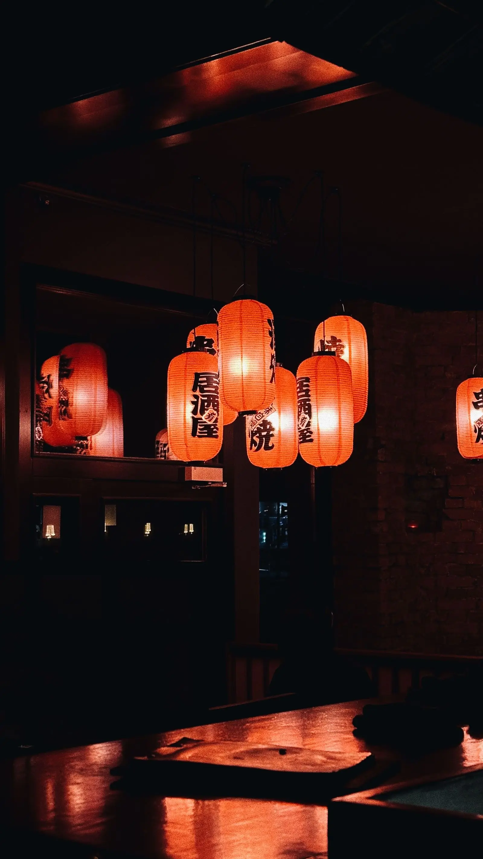 Paper lanterns glowing over the dining room at Umami
