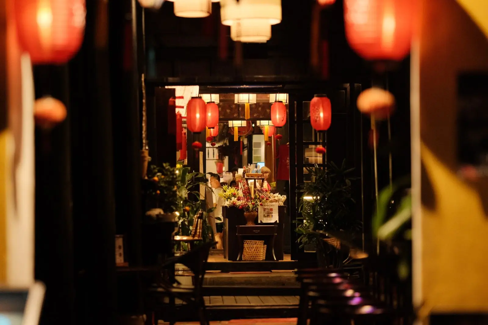 The dining room at Umami at night, lit warm and low
