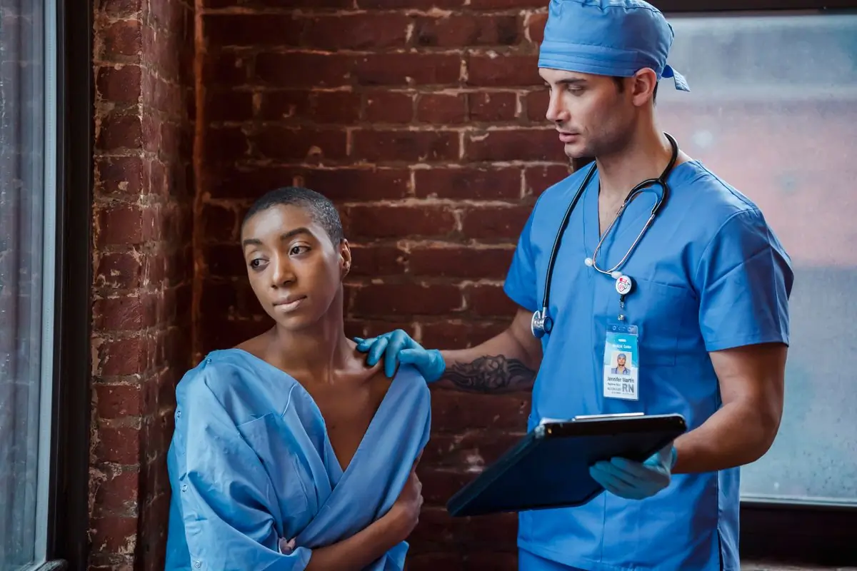A clinician talking a patient through their diagnosis
